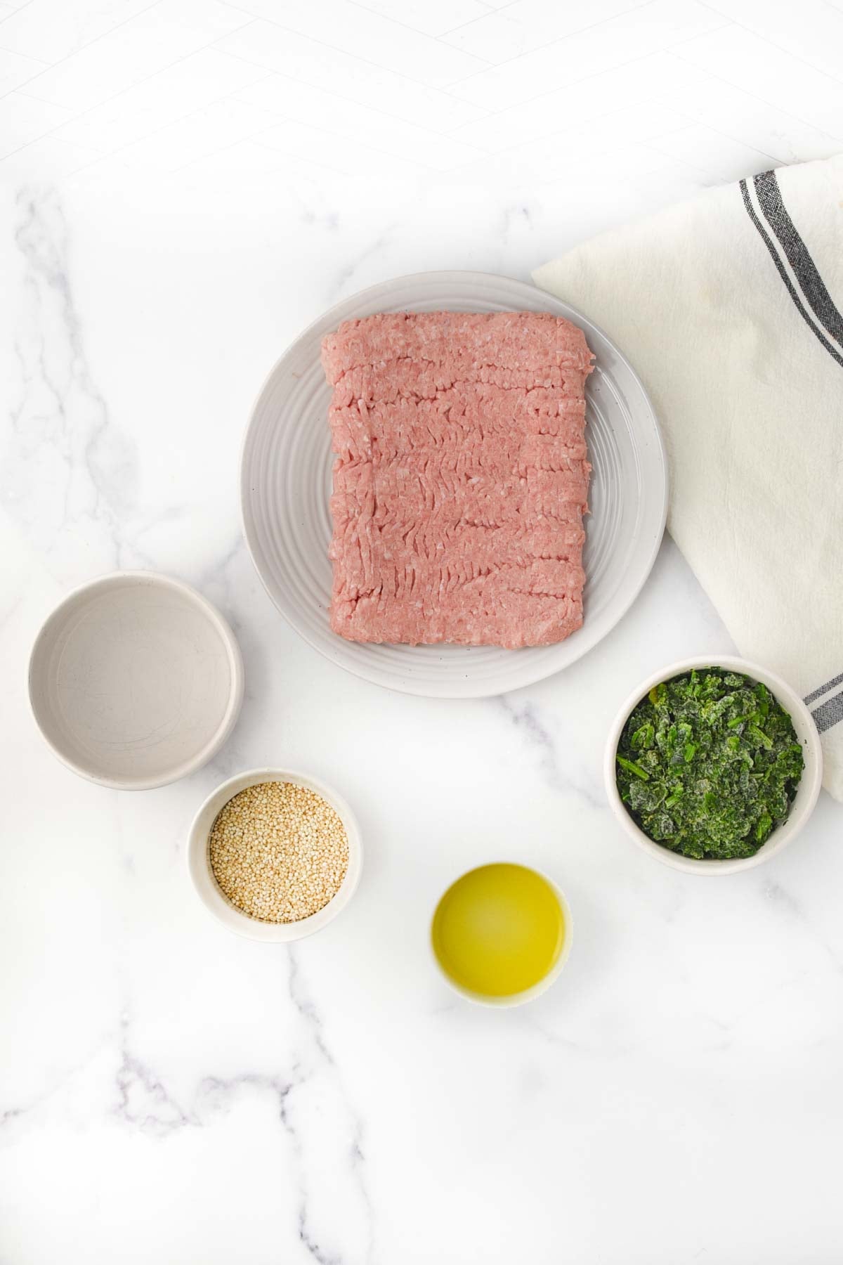 Ground turkey, chopped spinach, quinoa, olive oil, and water.