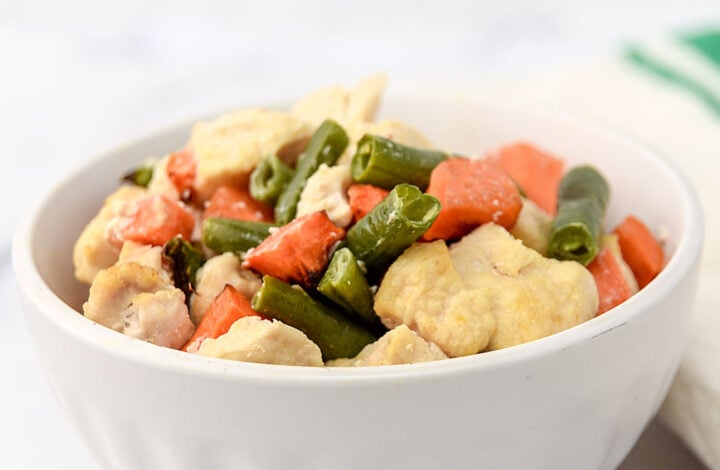 Air fryer chicken and veggie dog food in a bowl.