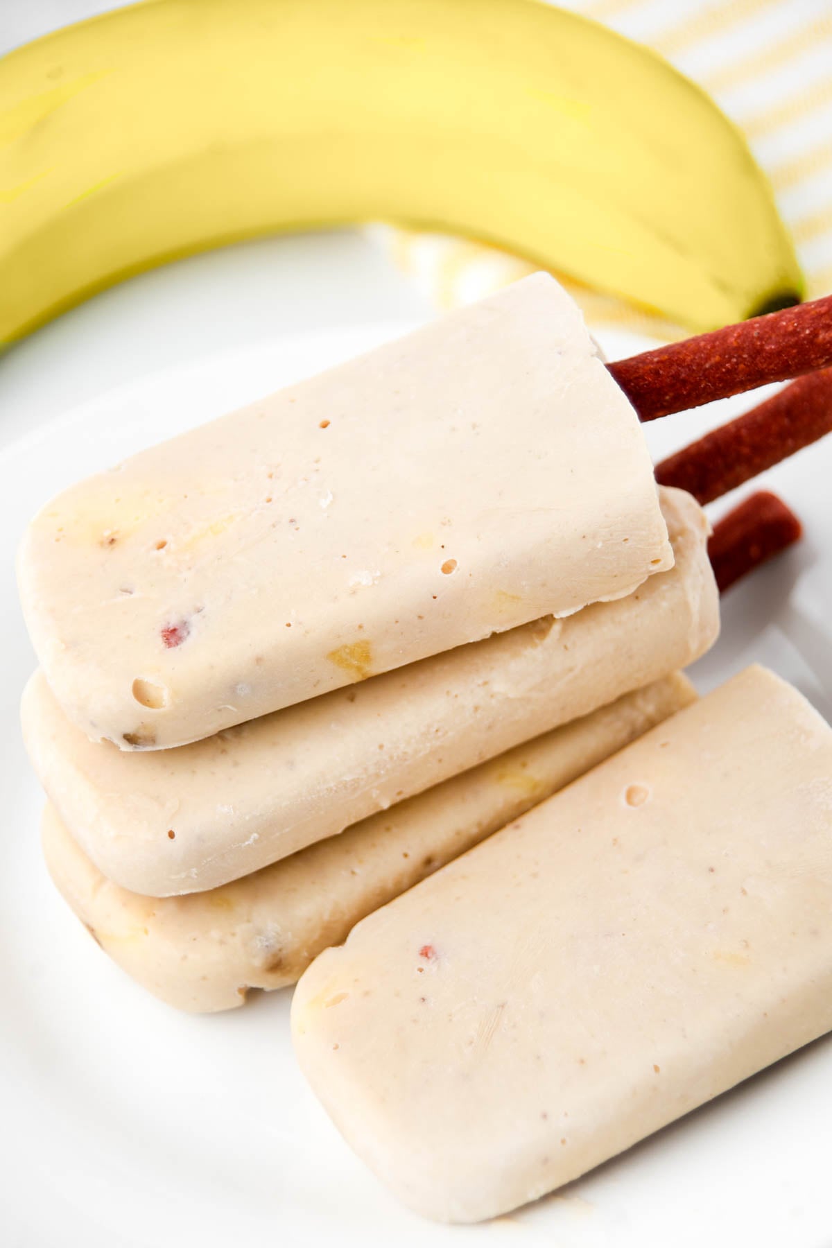 A banana and homemade banana popsicles for dogs.