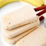 A stack of banana popsicles for dogs on a plate.