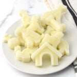 Homemade frozen goat milk dog treats piled on a plate.