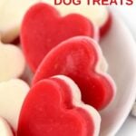 Frozen raspberry dog treats with a layer of yogurt.