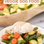 Sheet pan white fish and veggie dog food on the pan and a plate.