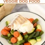 Sheet pan white fish and vegetable dog food on a plate.