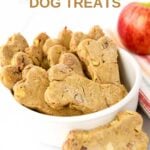 Homemade apple bacon dog treats in a bone shape and an apple.