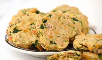 Homemade biscuits for dogs made with cheese, bacon, eggs, and spinach.