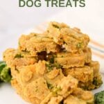 A pile of homemade kale dog treats on a marble surface.