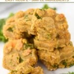 Homemade kale dog treats in paw shapes in a pile.
