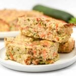 Homemade chicken meatloaf for dogs made with carrots, zucchini, oats, and eggs.