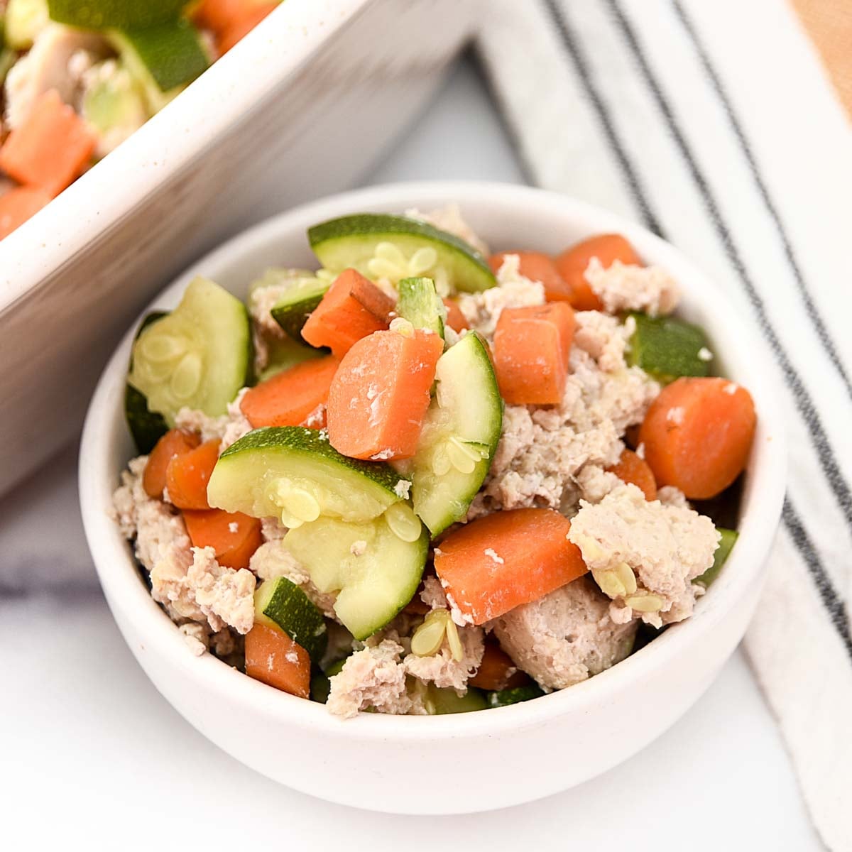Baked ground chicken and vegetable meal for dogs.