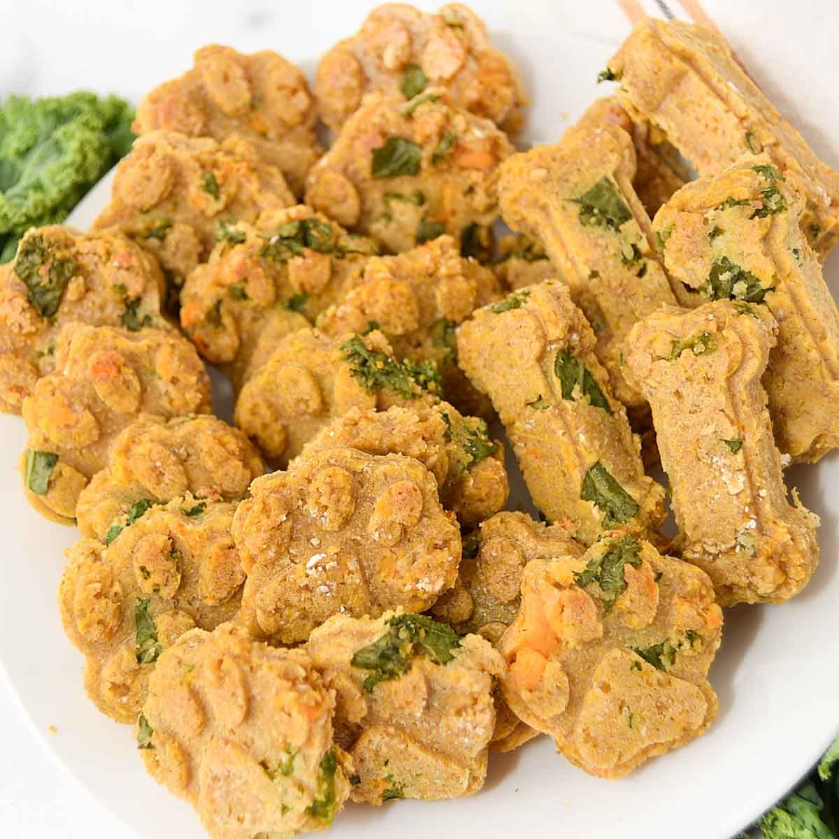 Homemade soft and chewy kale dog treats on a plate.