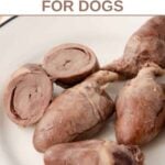 Cooked chicken hearts on a plate.