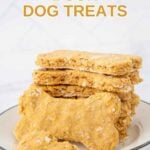 Homemade duck dog treats stacked on a plate.