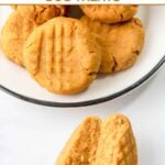 No-bake peanut butter pumpkin dog treats on a plate and one broken in half by it.