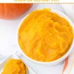 A pumpkin and homemade pumpkin puree on a spoon and in a bowl.