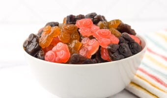 An assortment of fruity homemade gummy bears in a bowl.