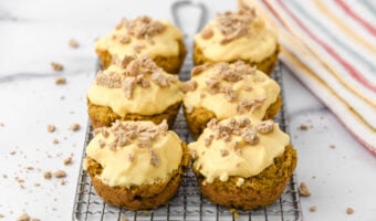 Homemade pumpkin pupcakes decorated with crushed dog treats.