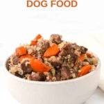 A bowl of homemade air-fried beef and carrot dog food with quinoa in a small bowl.