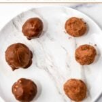 Homemade peanut butter carob truffles for dogs on a plate.
