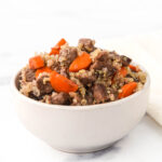 Homemade beef and carrot dog food with quinoa made in an air fryer.