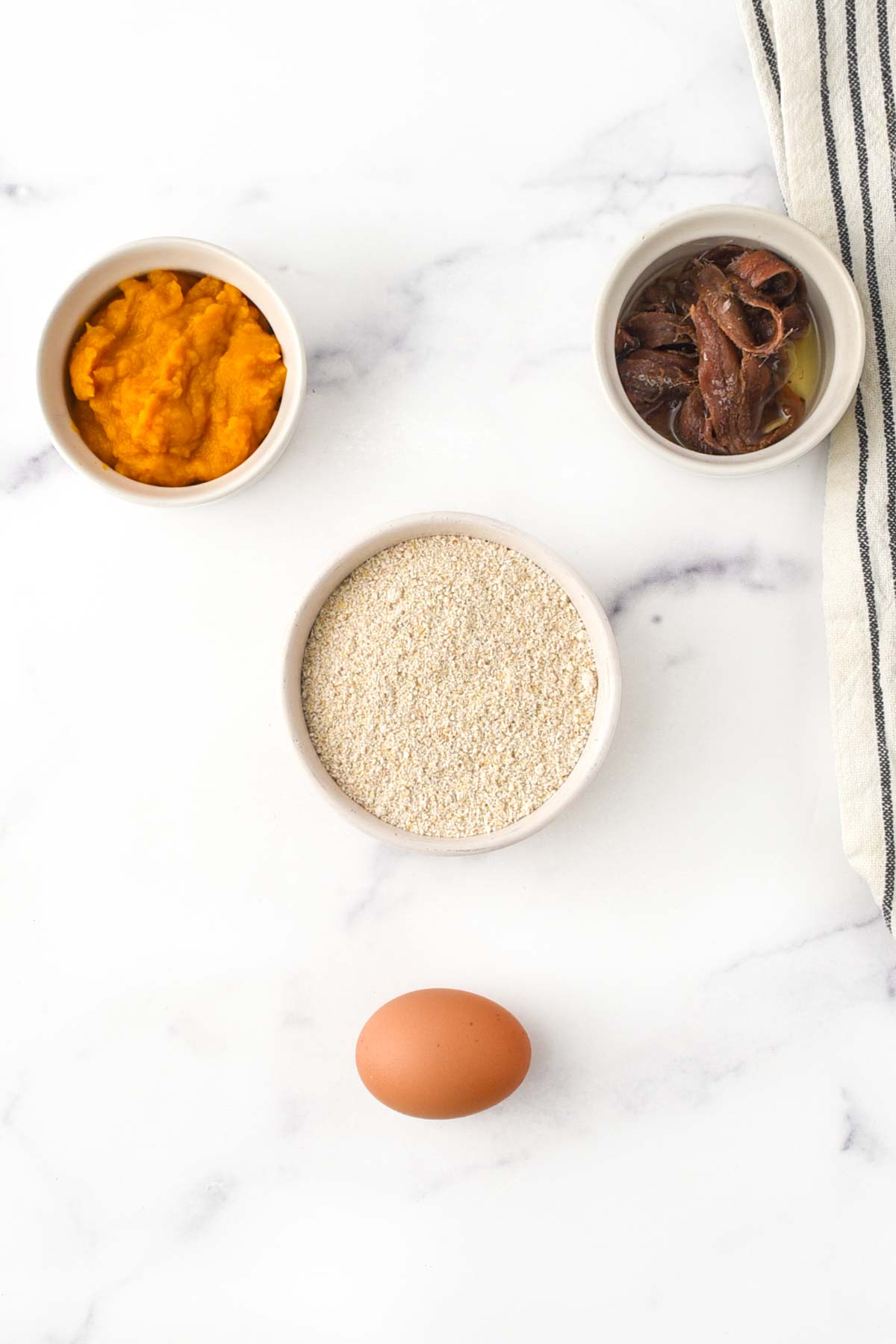 Anchovies, pumpkin, egg, and oat flour.