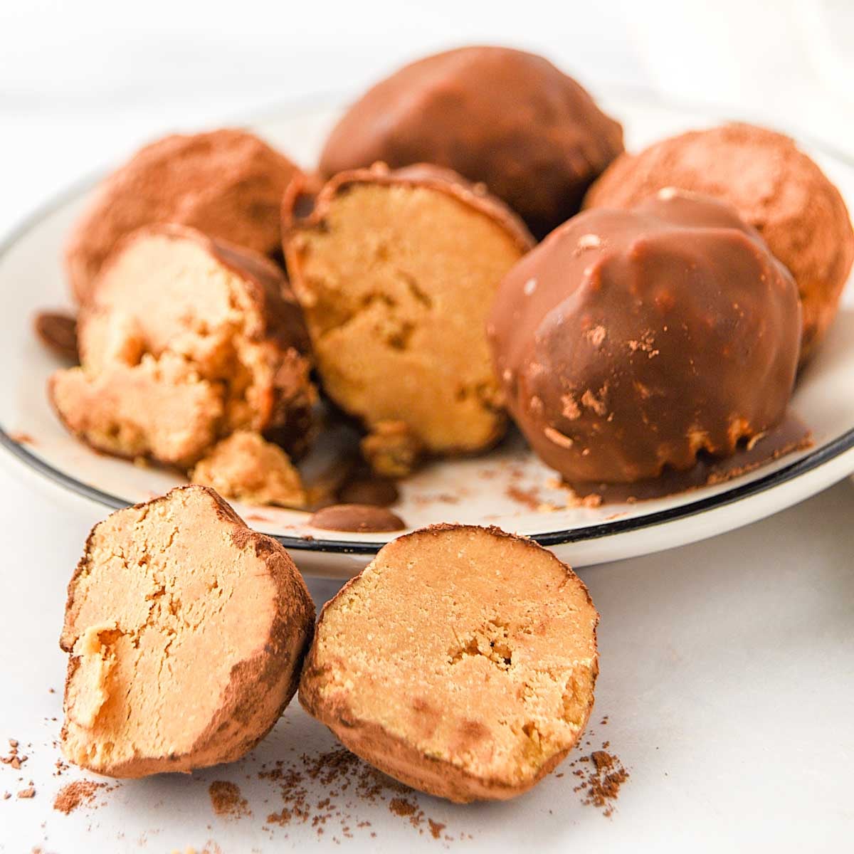 Homemade peanut butter truffles for dogs coated with carob.