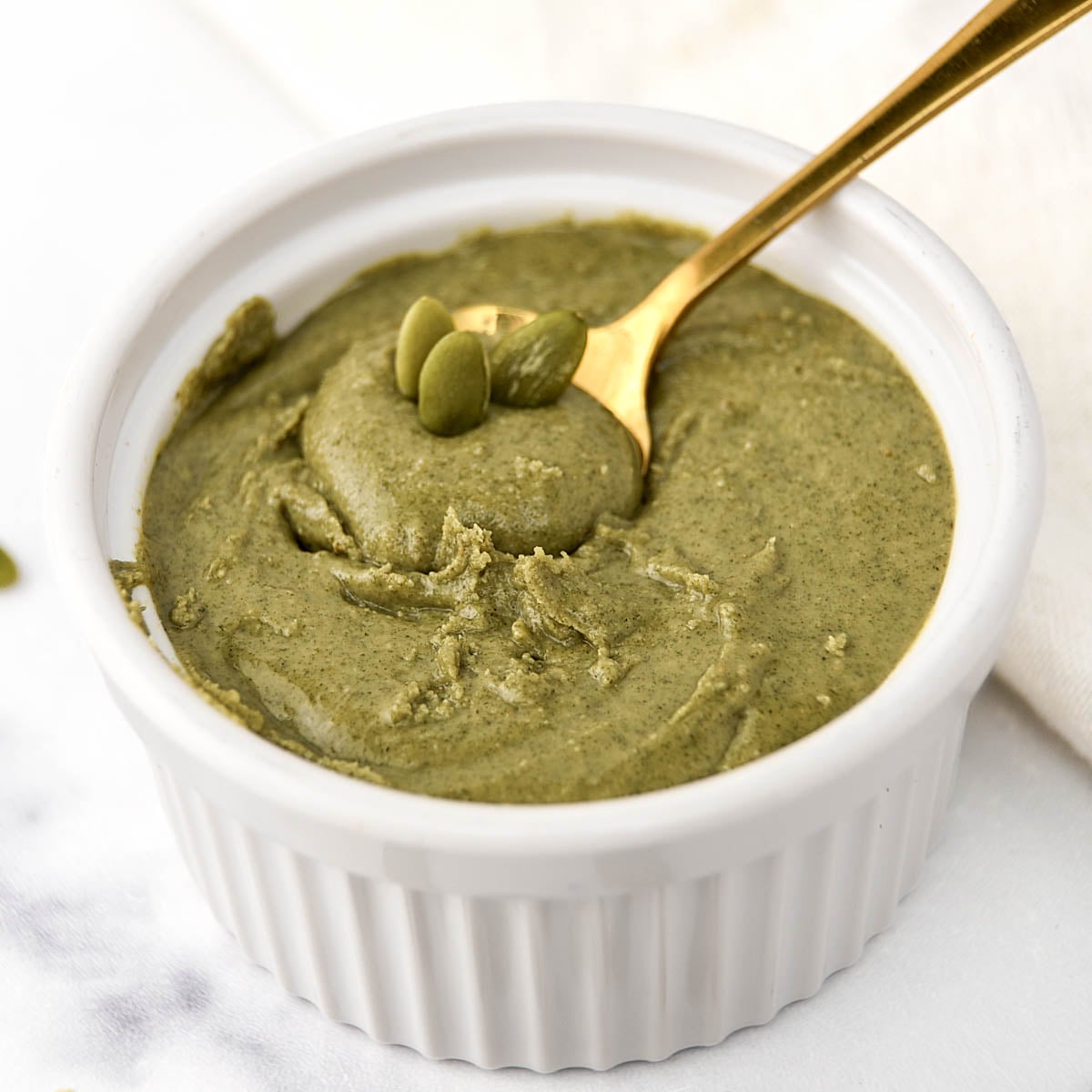 Homemade pumpkin seed butter in a ramekin.